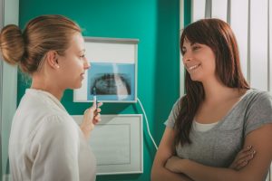Woman speaking with a dentist
