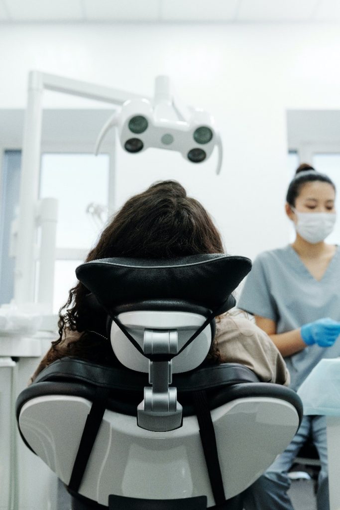 Woman getting braces at the dentist’s office