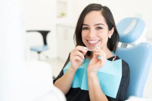 Woman smiling while sitting at a West Hills, CA dentist clinic