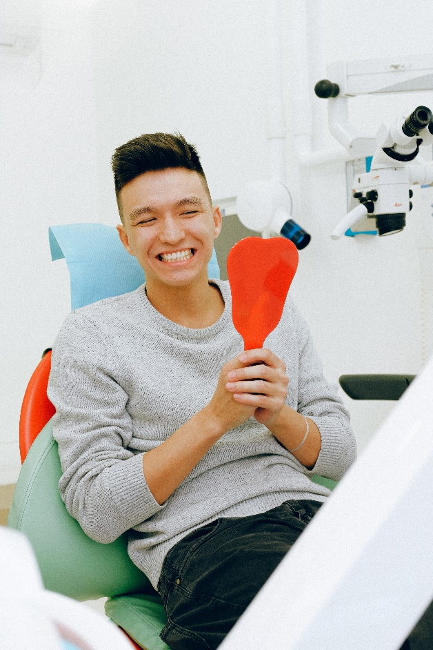 A Man Smiling After Dental Treatment