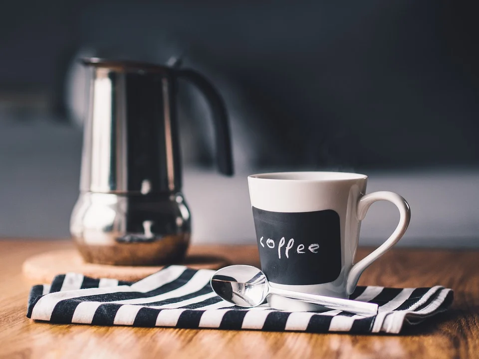 Coffee mug and a coffee pot. 