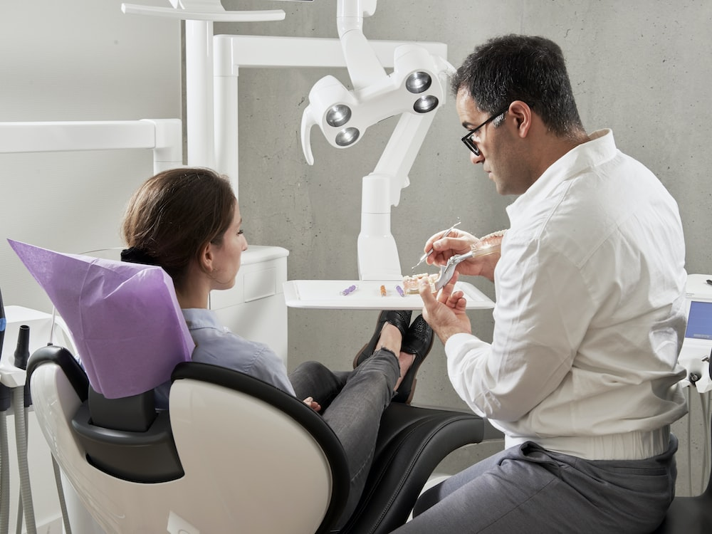 a dentist talking to a patient