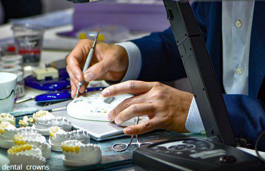 A dental technician creating a dental crown