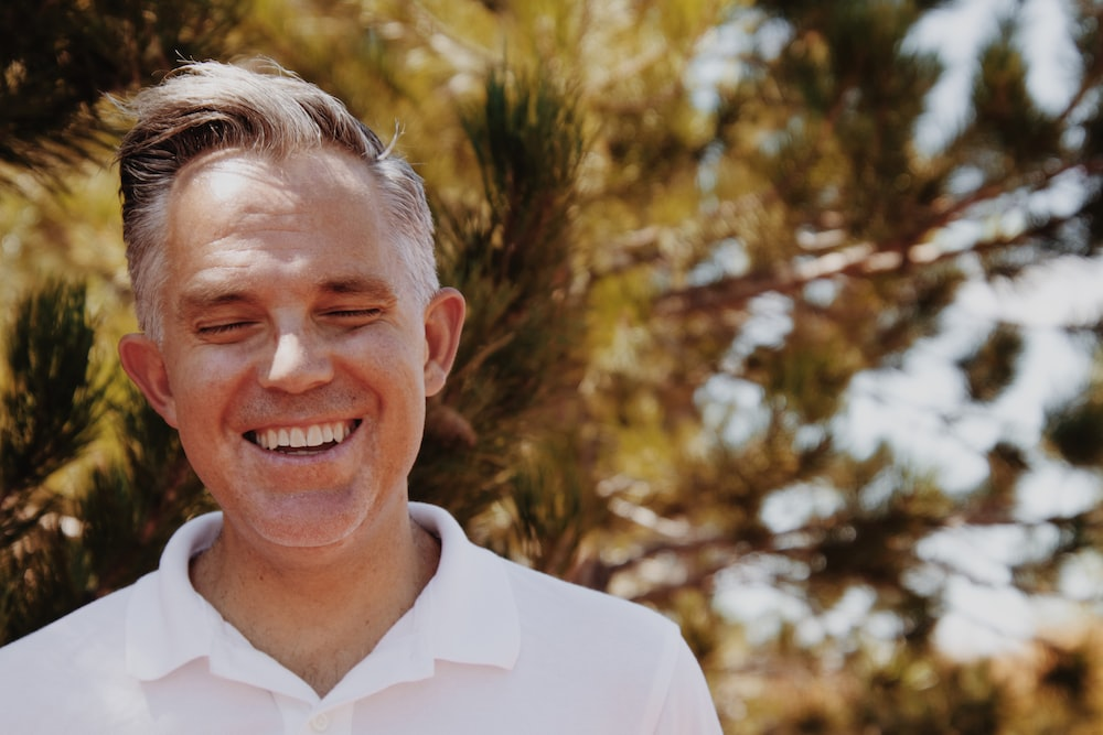 a man with dental veneers smiling