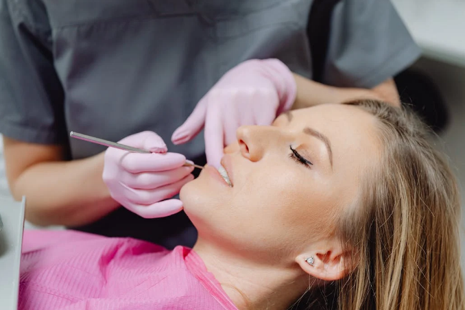 A female patient receiving dental treatment at a clinic