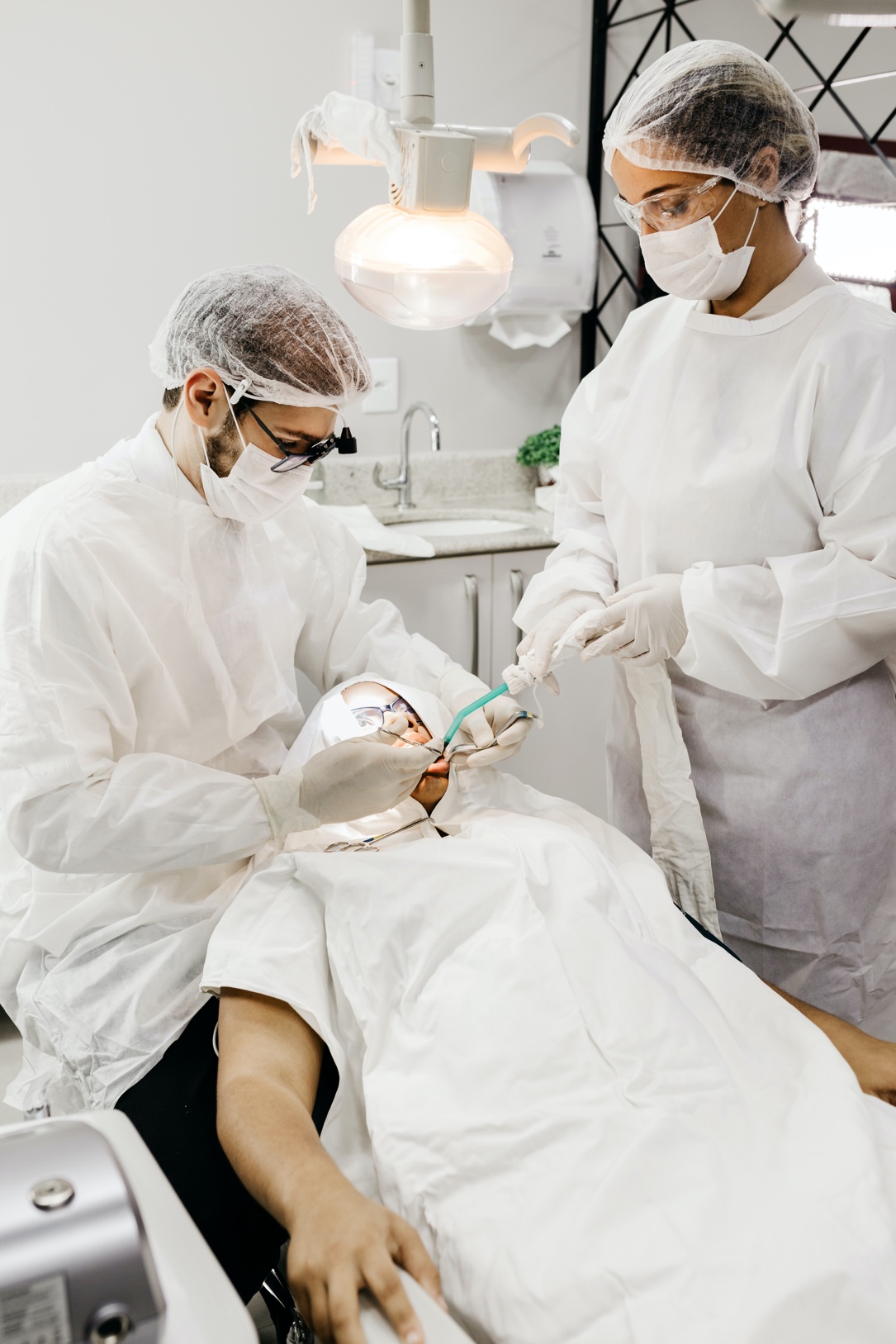 A dentist performing a dental procedure on a patient