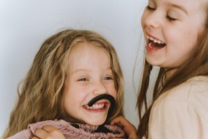 Close-Up of Two Girls Laughing