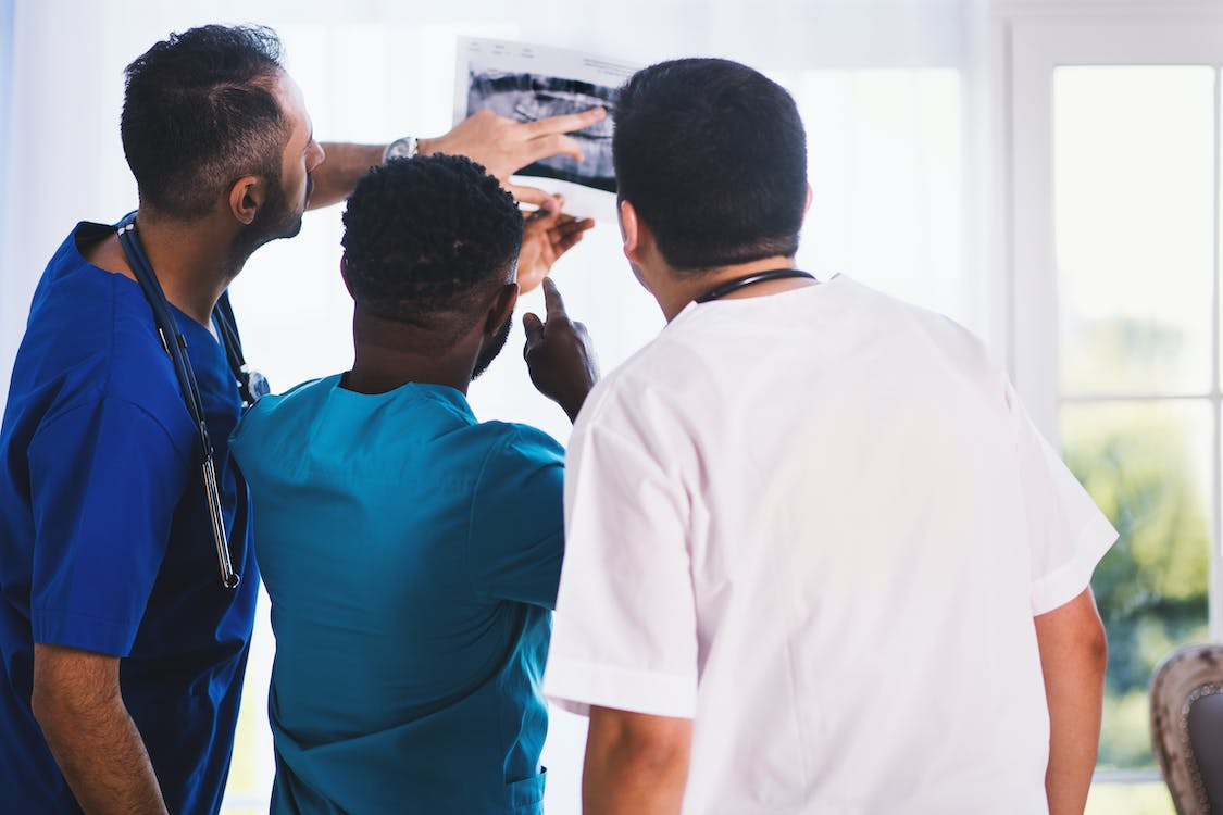 Dentists looking at a digital x-ray