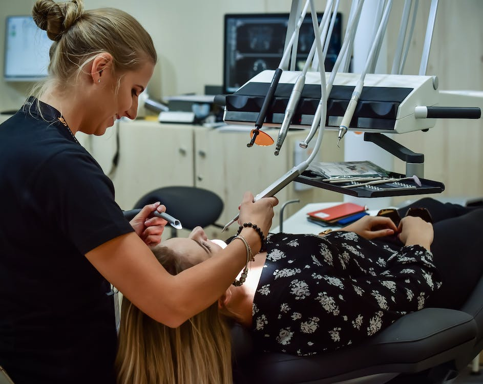 A dentist treating a patient