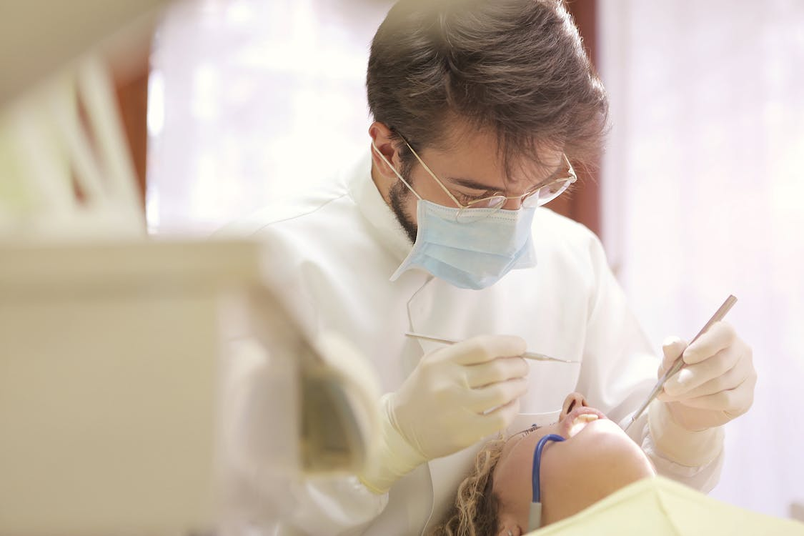 A dentist performing an examination