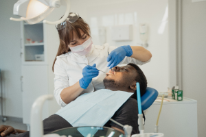 A man being examined in a dentist’s chair