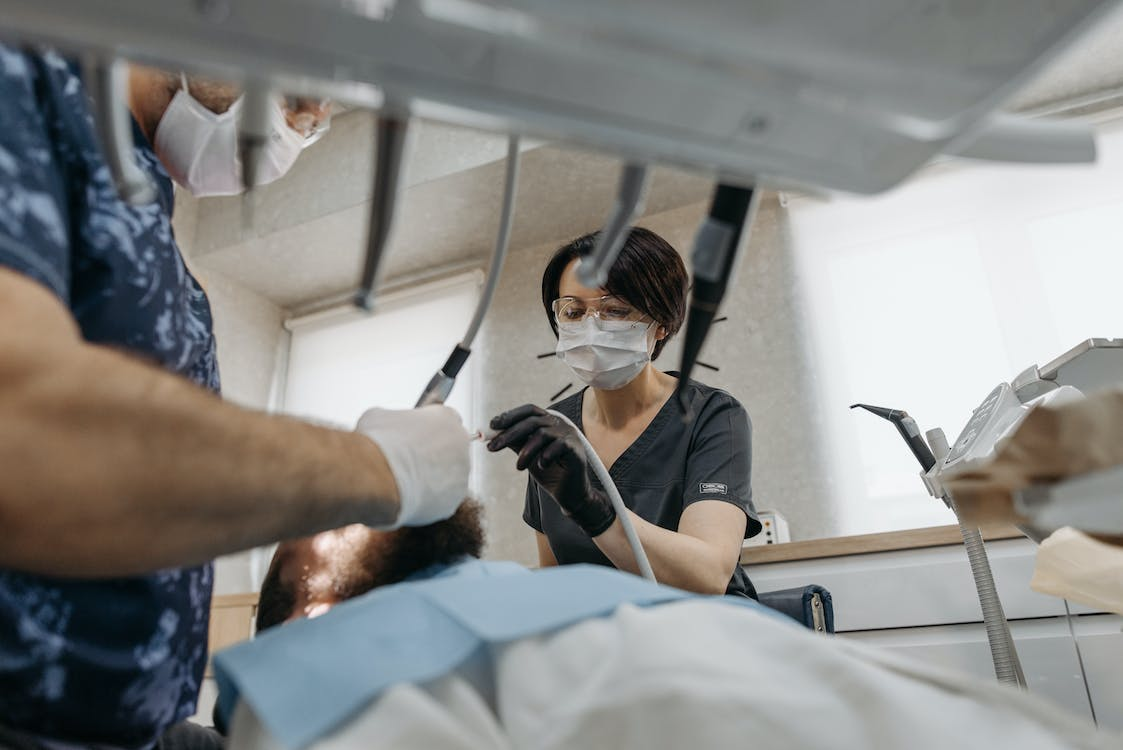 A dentist and sedated patient