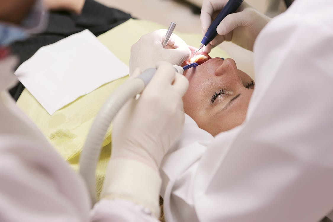 A sedated patient undergoing dental procedure