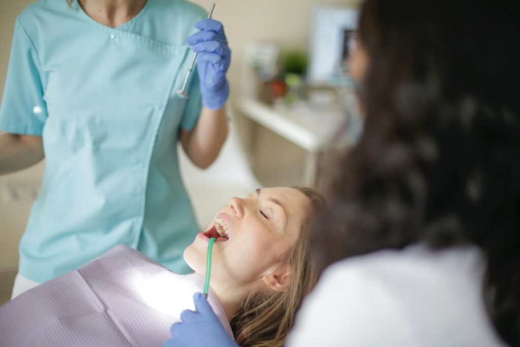 A dentist sedating her patient