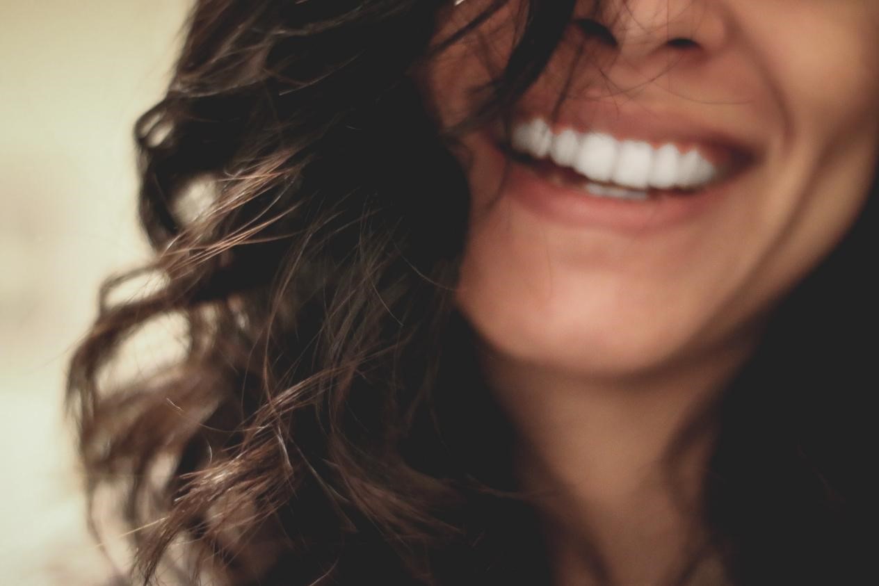 Close-up of a woman with white teeth