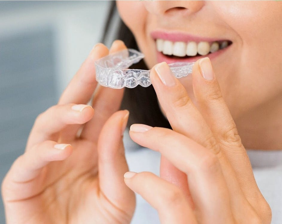 A woman using Invisalign