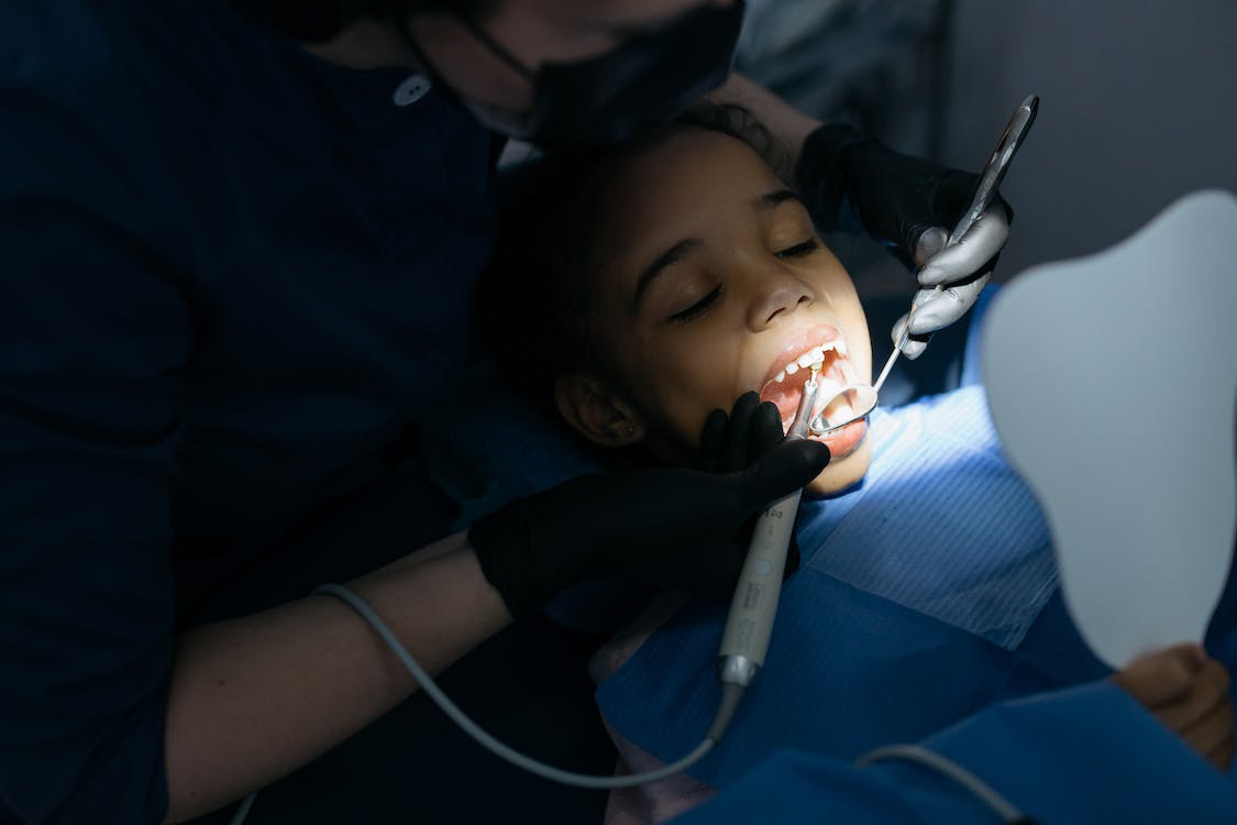 An image of a little girl having a dental checkup