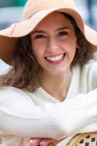 A Lady in a hat with a beautiful smile