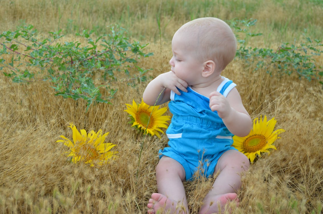 An image of a baby sucking his thumb