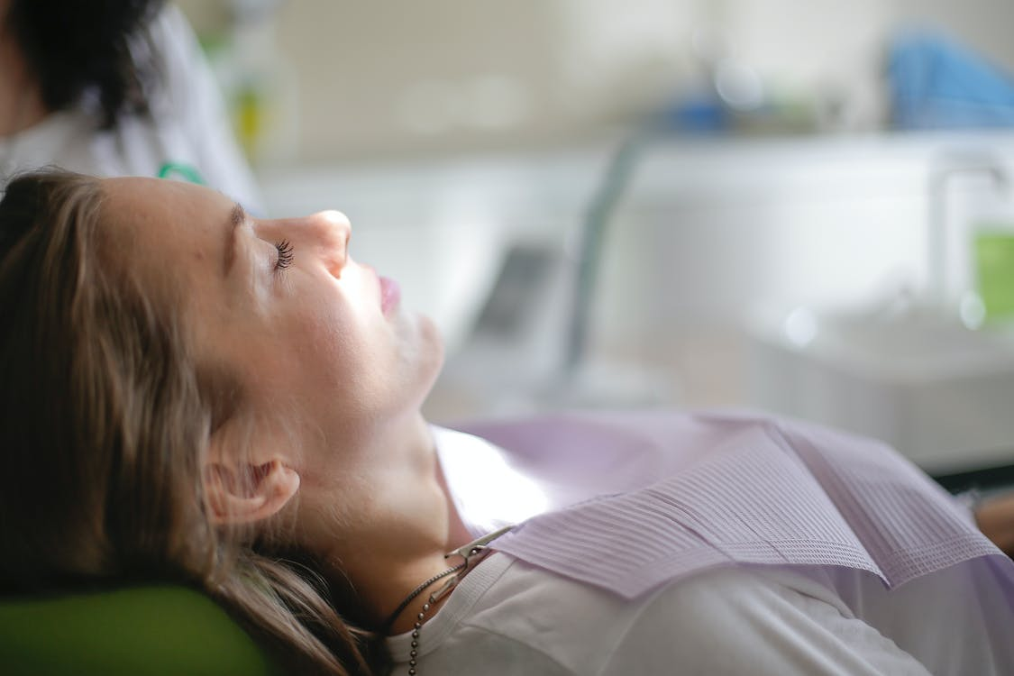 A patient lying on a dental chair