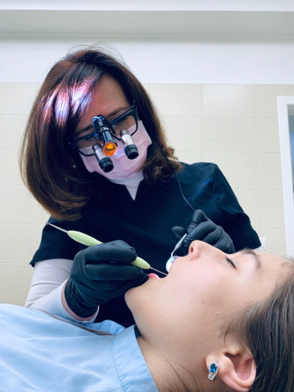 An image of a woman a getting dental check-up